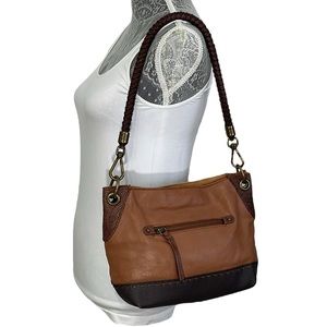 The Sak multi‎ tone brown leather shoulder bag. Braided strap. Brass hardware.